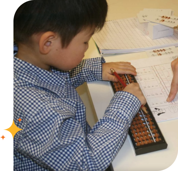 A JAMS student practicing on the abacus